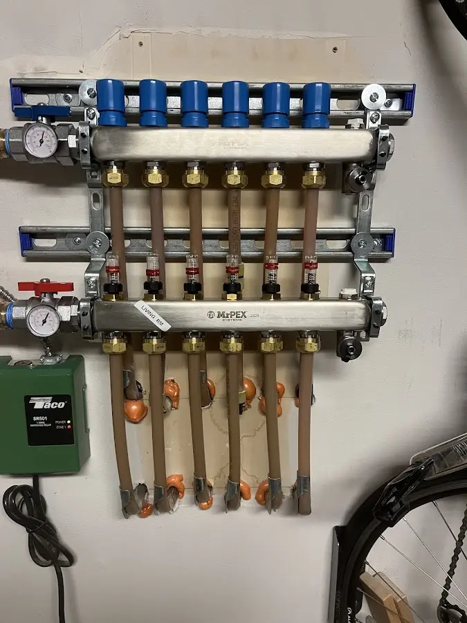 Plumber performing Water Heater Repair at a residential property in Jefferson